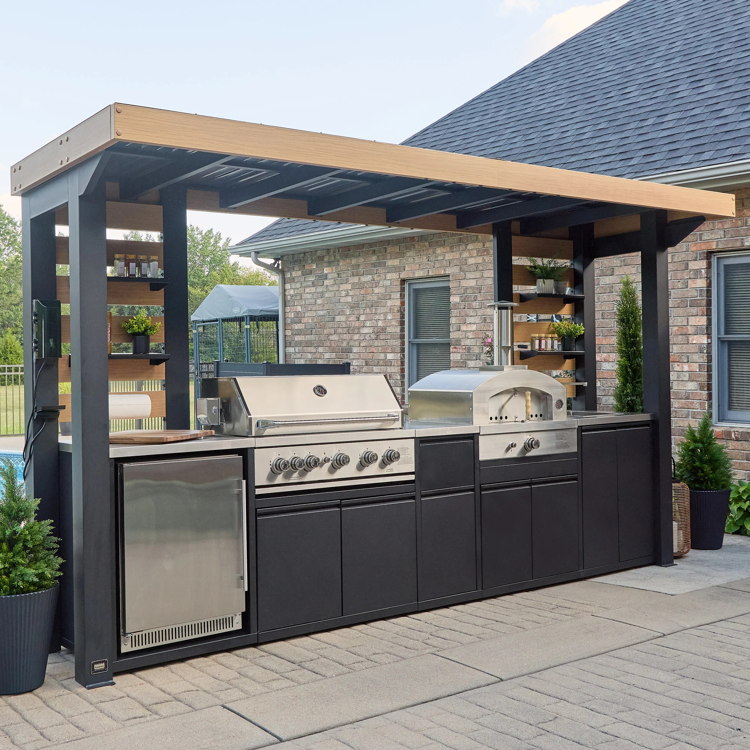 Complete outdoor kitchen with grill and pizza oven
