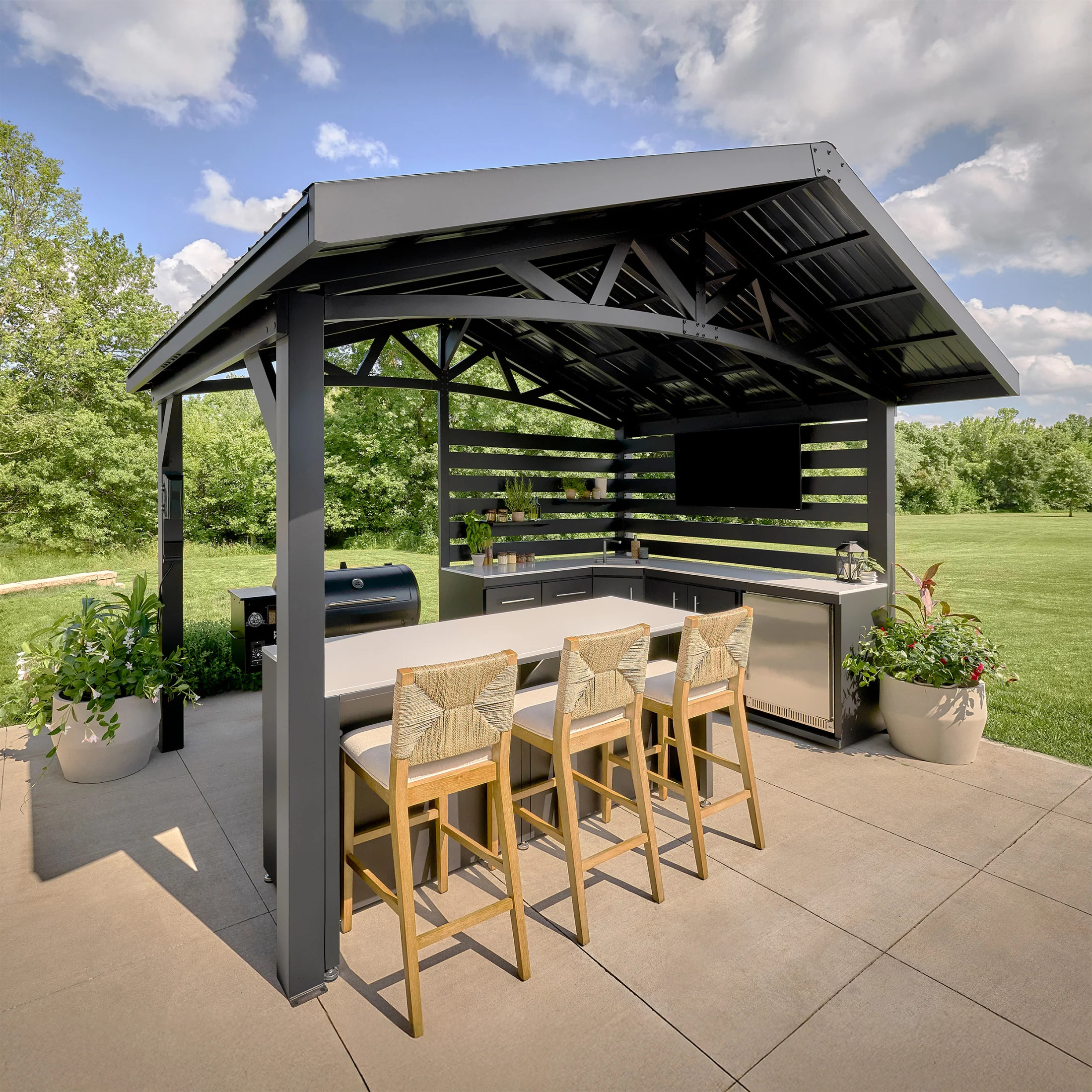 Covered outdoor kitchen with seating